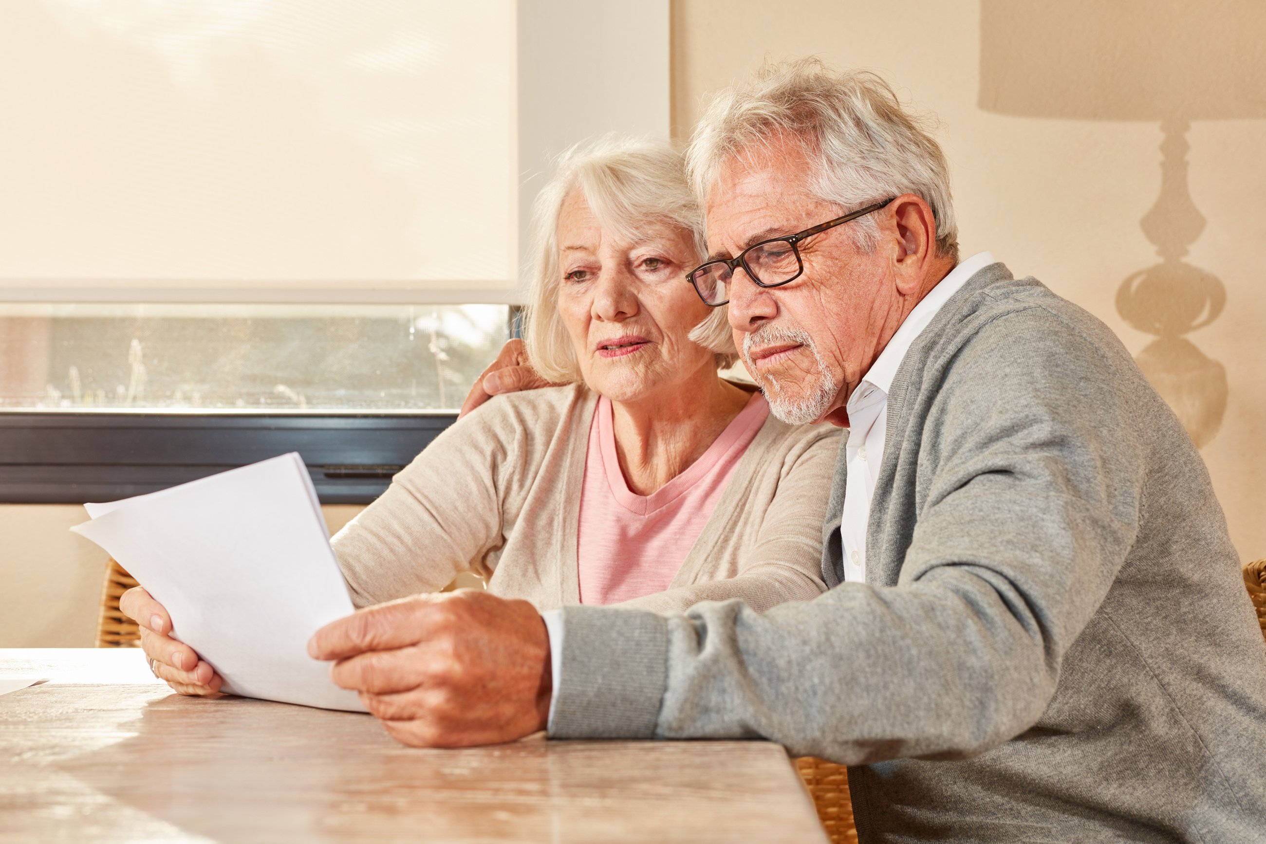 Senior Couple Reading Retirement Plan